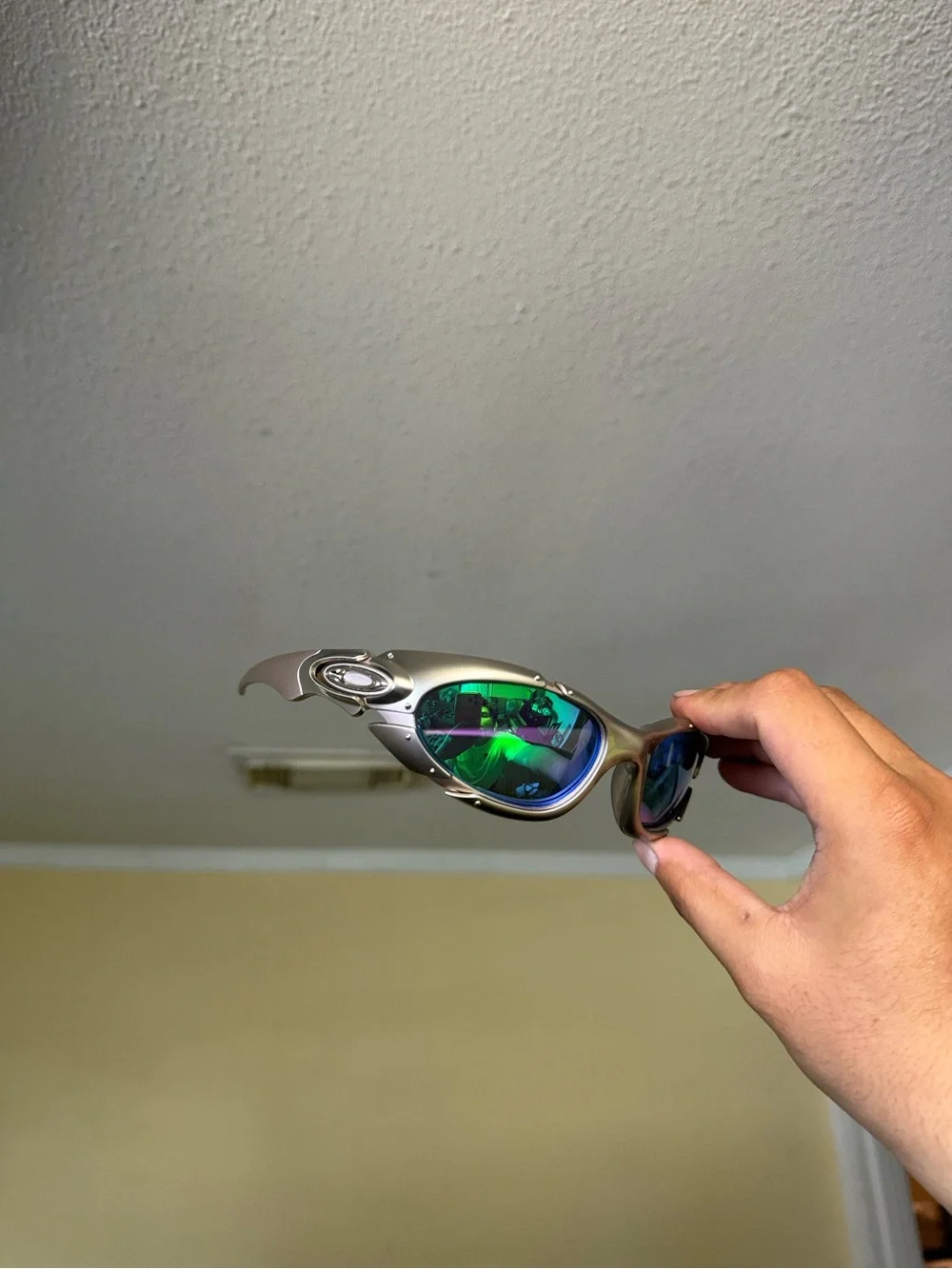Oakley Silver Frame Sunglasses with Green-Blue Mirrored Lenses Oakley